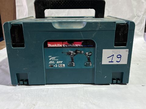 Makita case containing 2 impact drivers