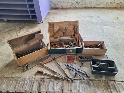 A consignment of antique and vintage joinery tools in wooden crates